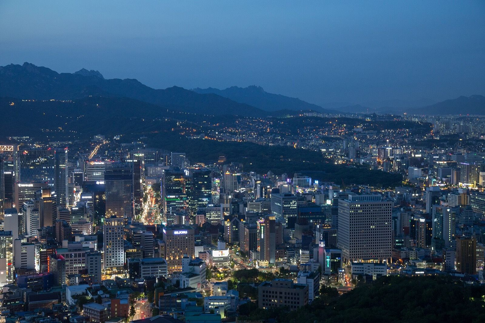 Seoul city skyline with mountains behind